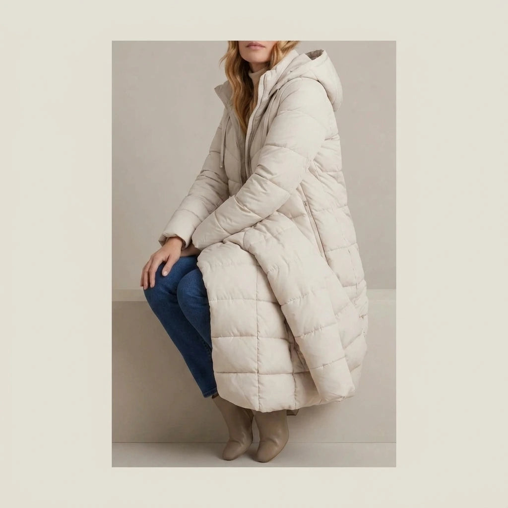 Women's Cozy Longline Puffer Jacket – Clover — variant_lifestyle_v_b7efc41a3d__langley-cozy-longline-puffer-jacket-for-women_lifestyle_seated_pause_04.webp