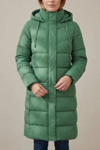 Women's Cozy Longline Puffer Jacket – Clover — langley-cozy-longline-puffer-jacket-for-women_wearing_product_focus_06.webp
